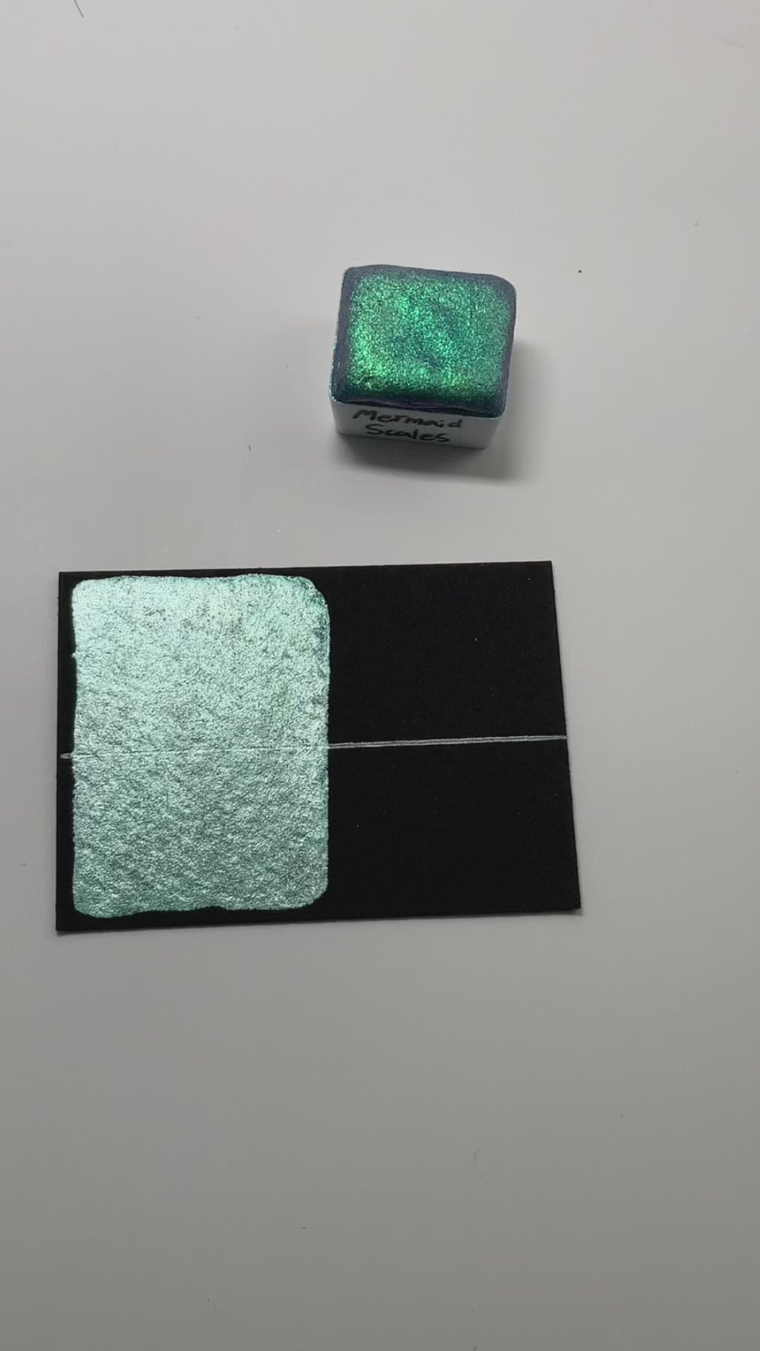 Shown with a swatch of Striking Spearmint for comparison